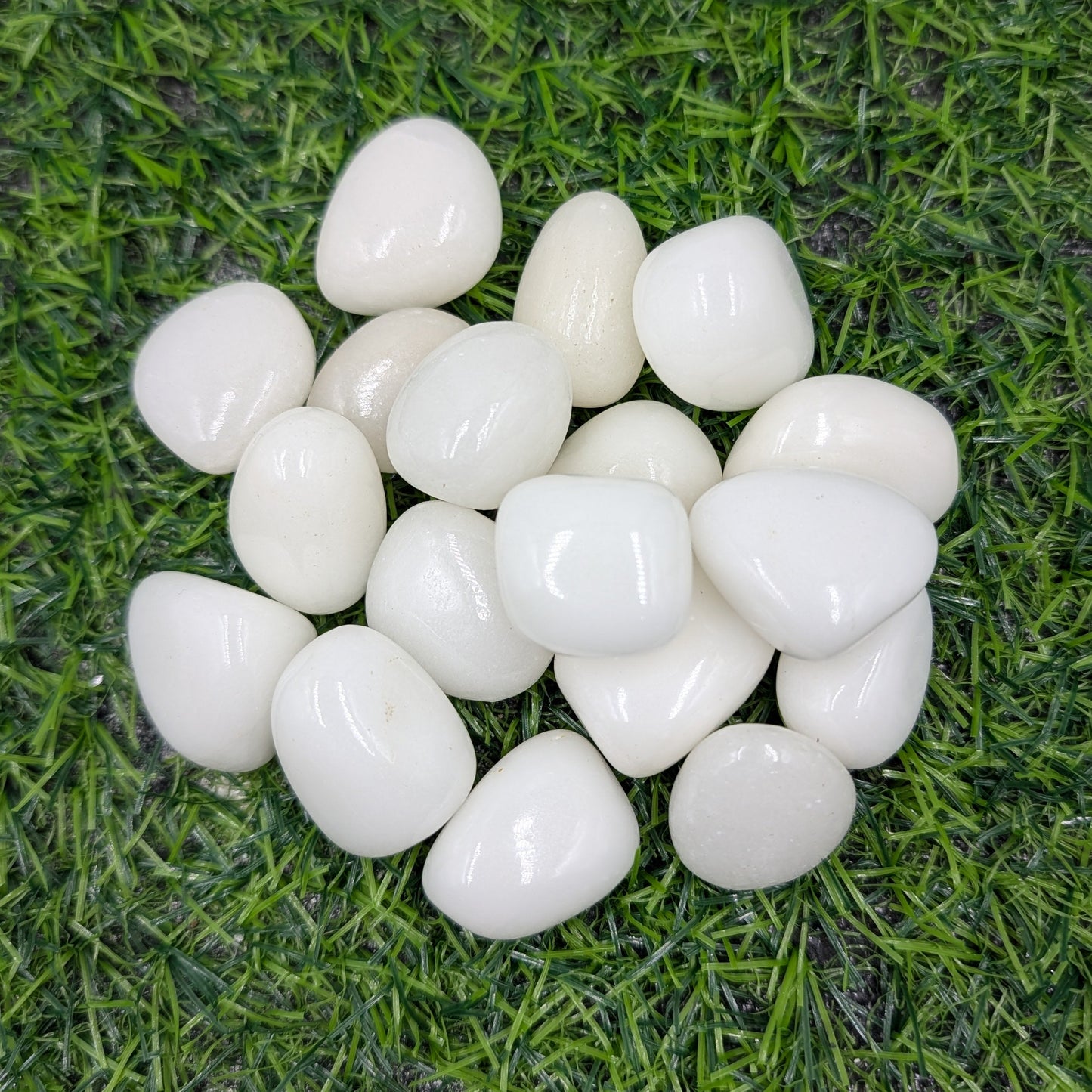 White pebbles on artificial grass