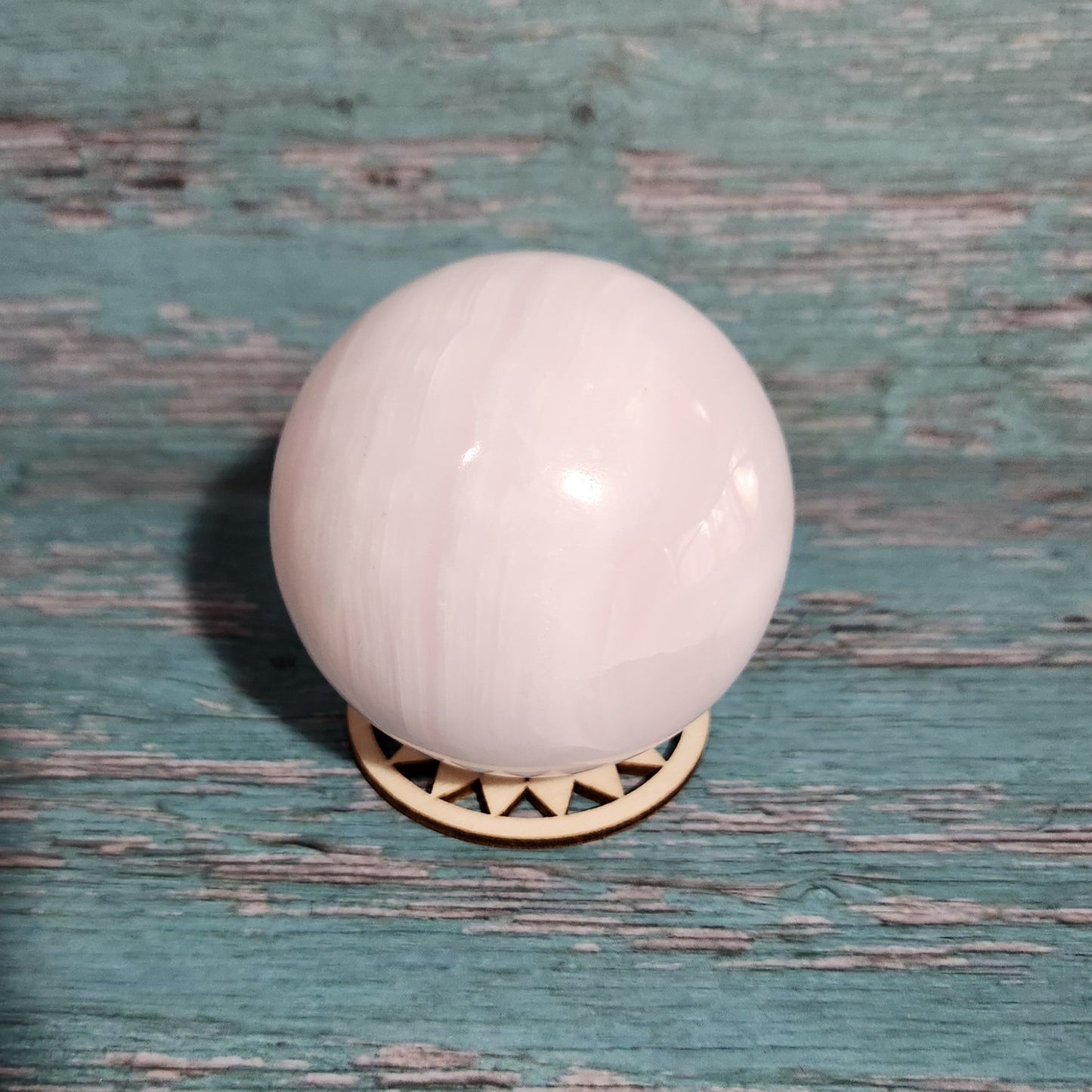 White door knob on a textured green door