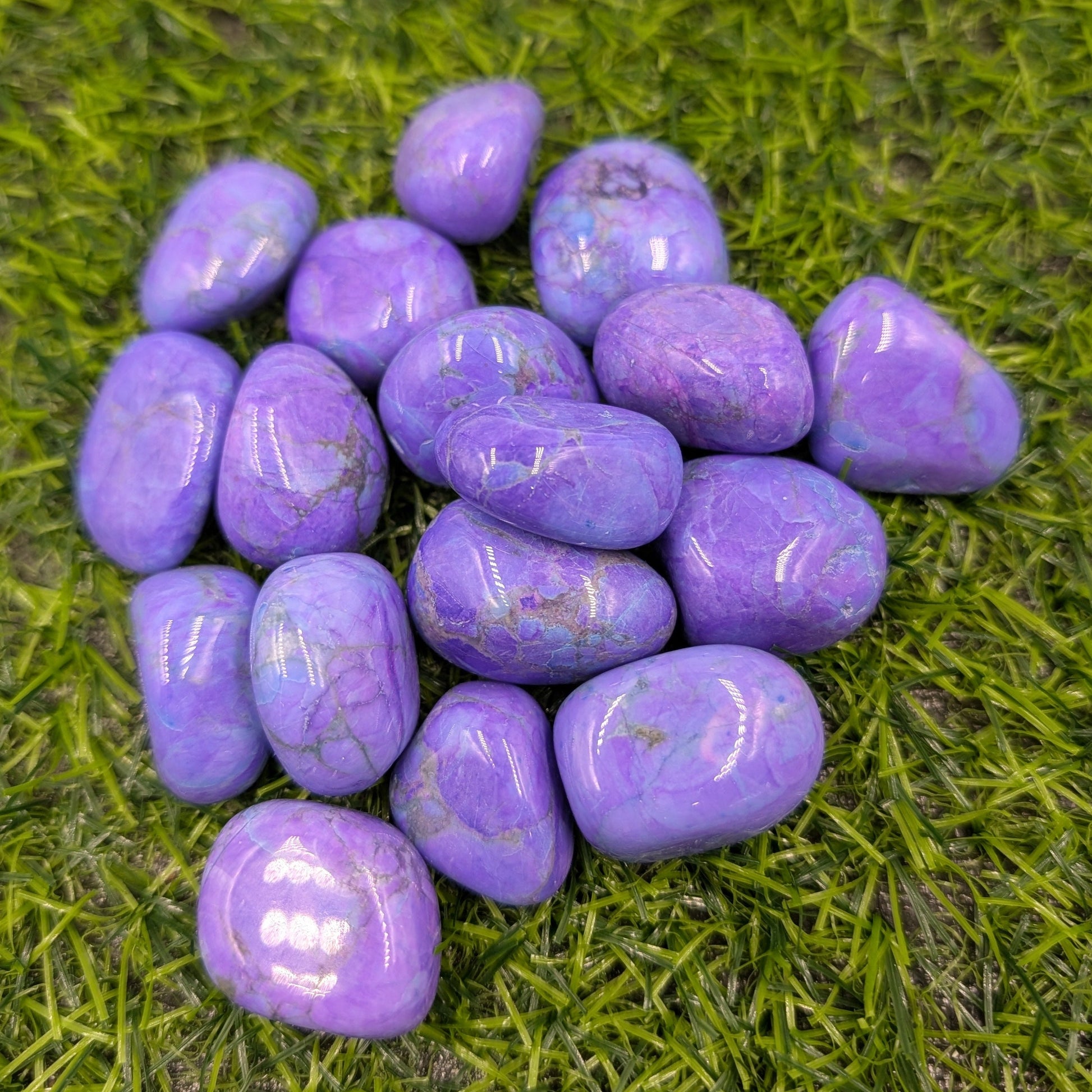 Purple stones on a green grass background