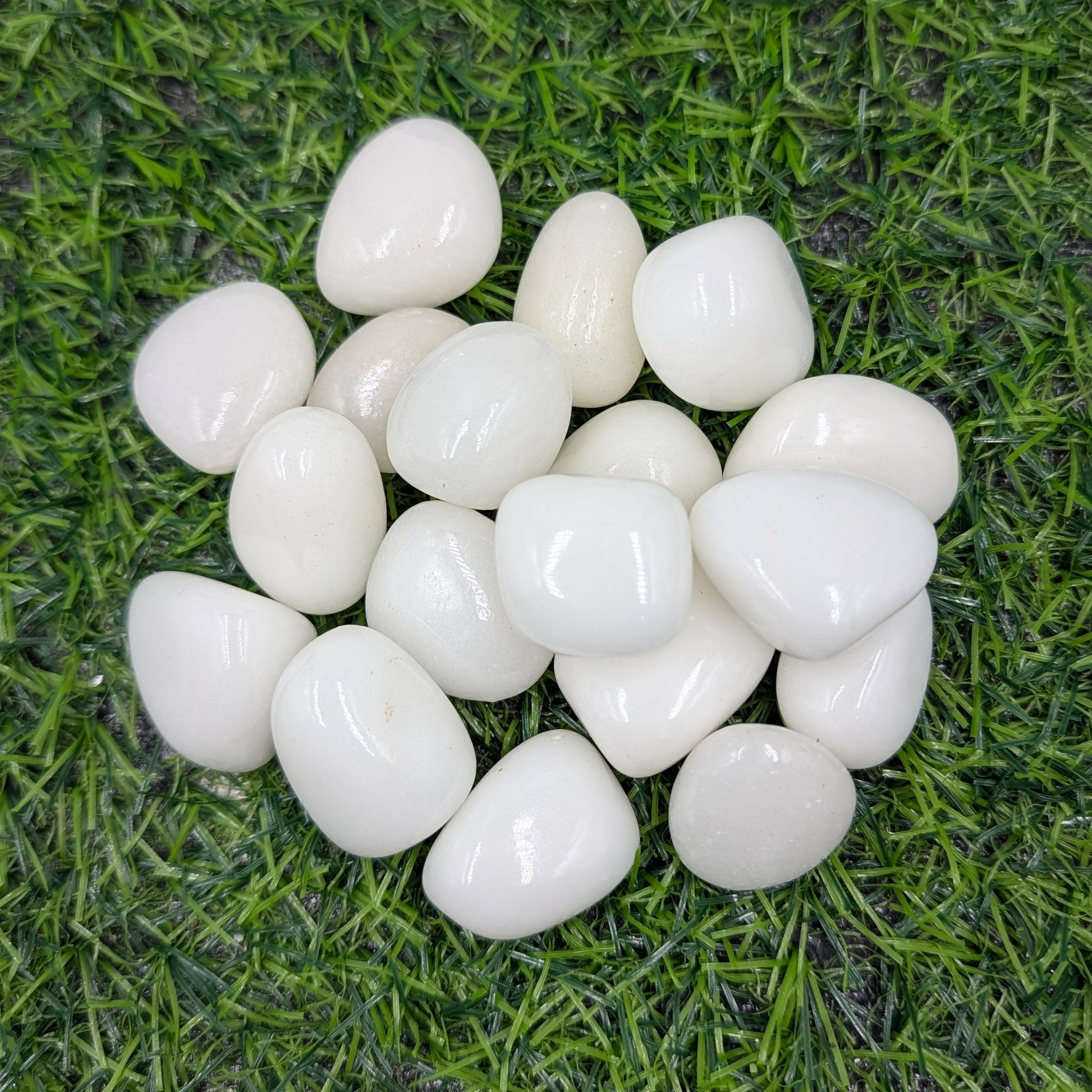 White pebbles on artificial grass