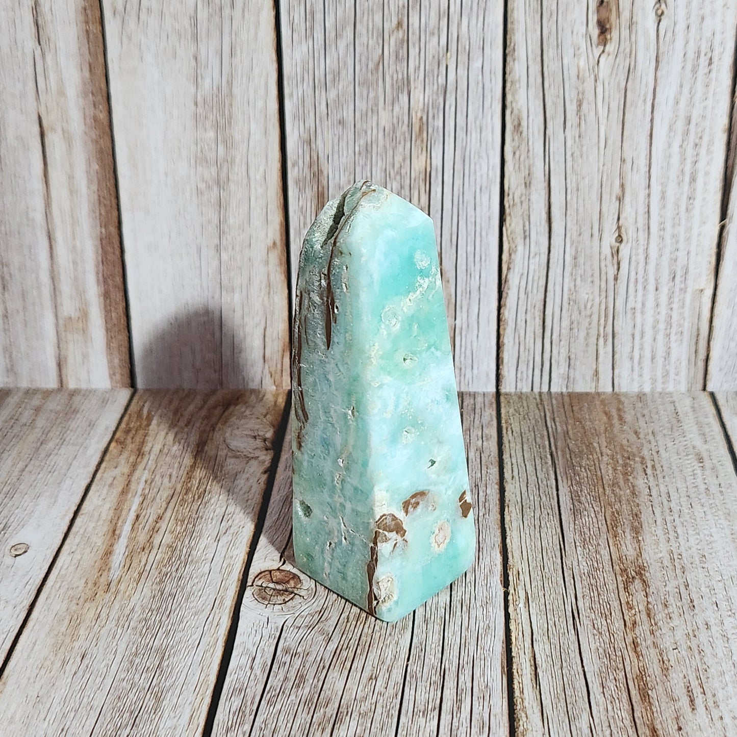 Turquoise stone on a wooden surface