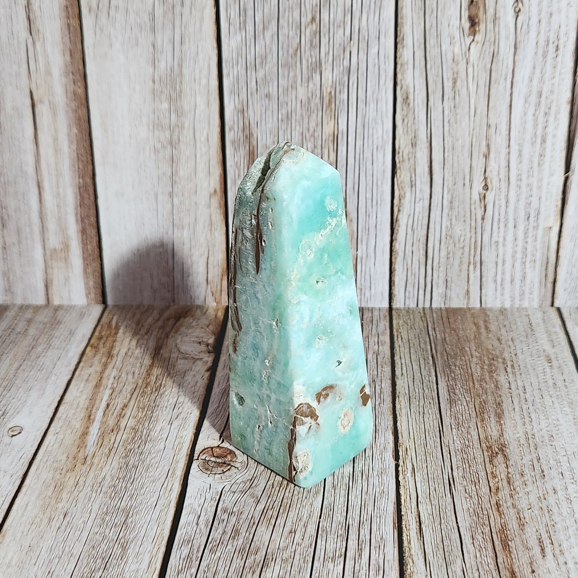 Turquoise stone on a wooden surface