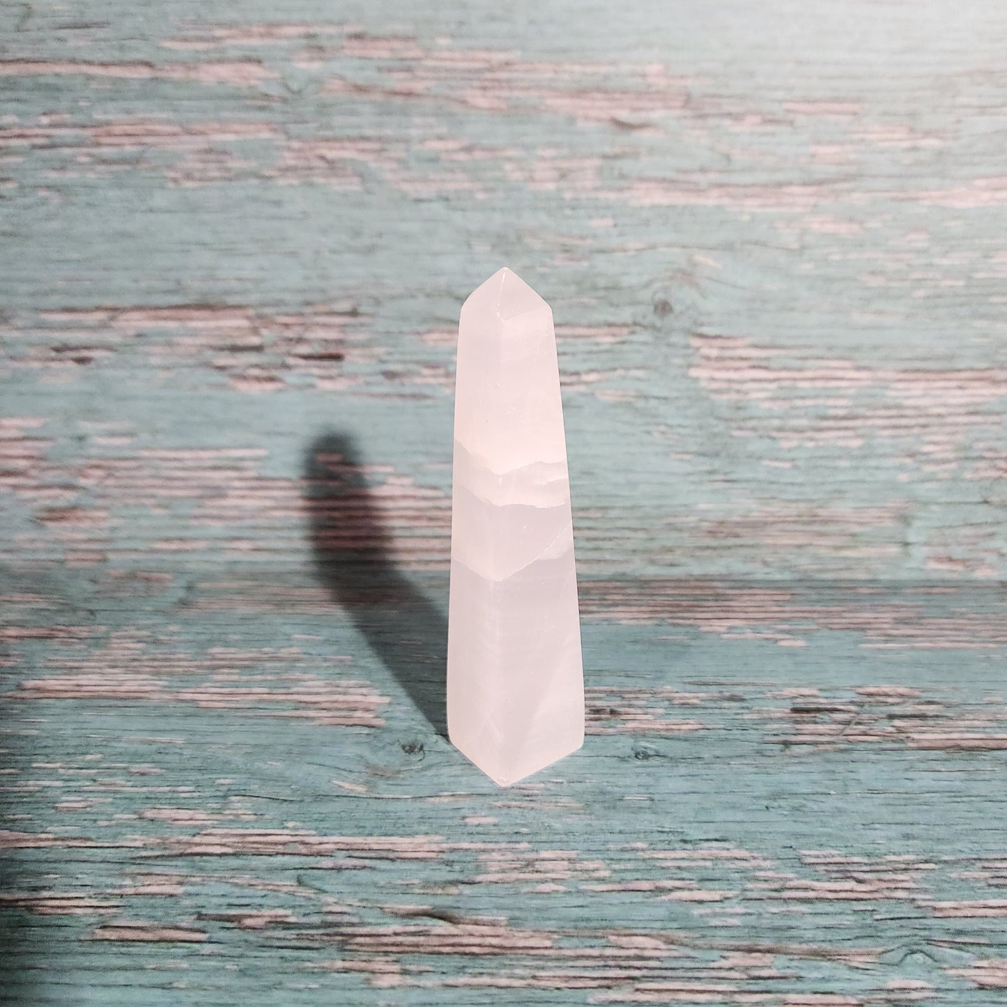 Small white rectangular object on a textured blue surface