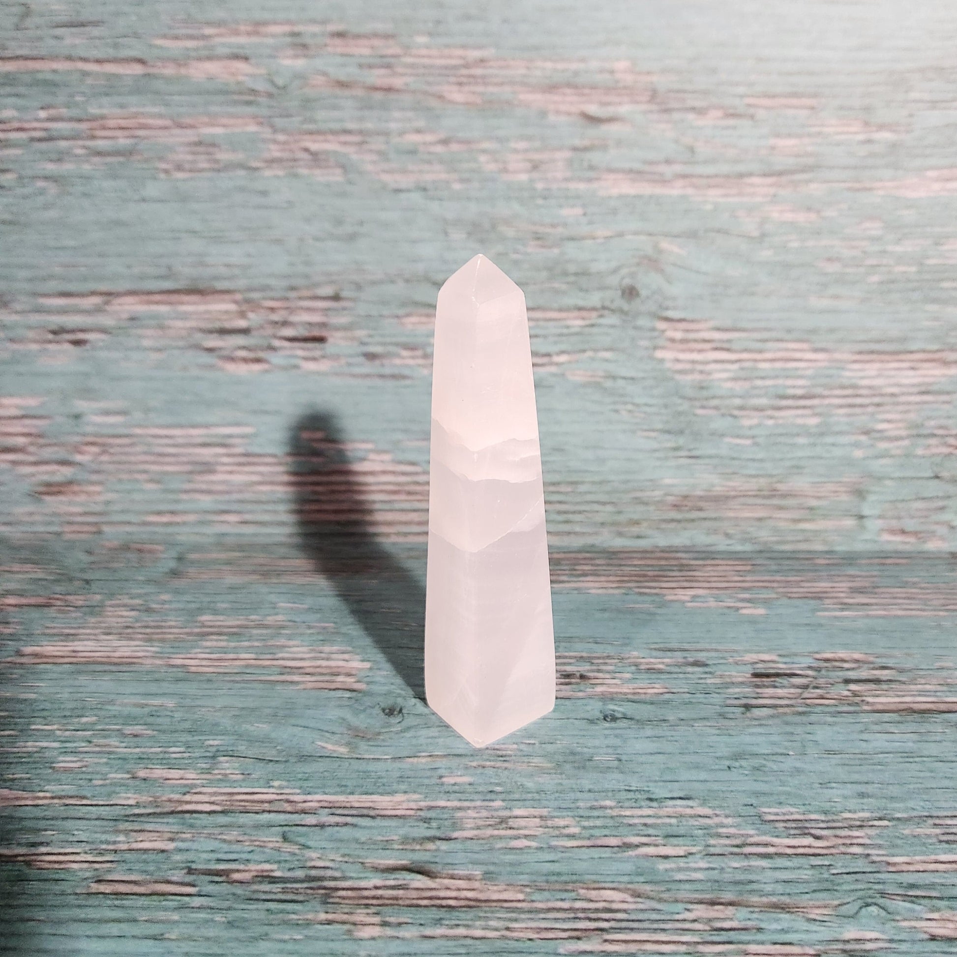 Small white rectangular object on a textured blue surface