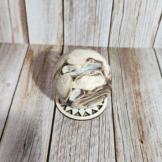 Decorative metal door knocker on a wooden surface