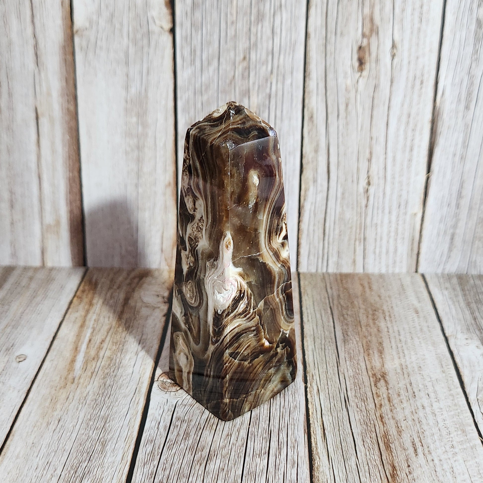 Marble-patterned object on a wooden surface