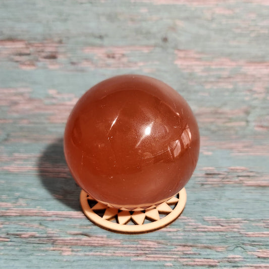 Brown spherical doorknob on a textured blue door