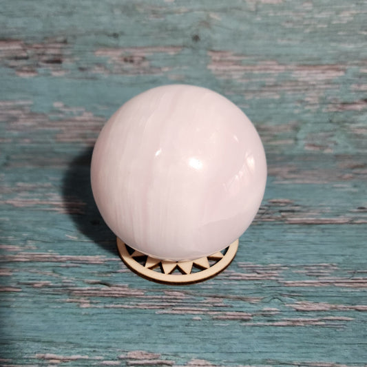 White door knob on a textured green door