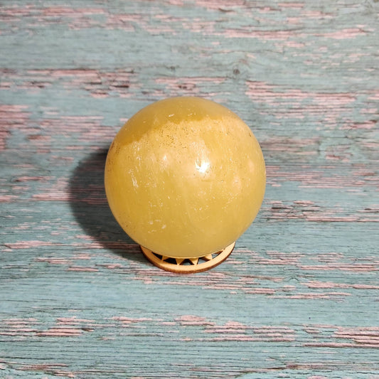 Yellow door knob on a textured blue door