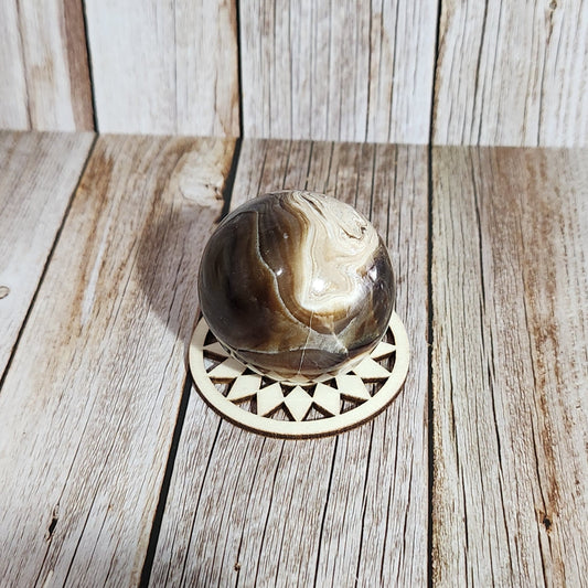 Decorative shower head on a wooden wall
