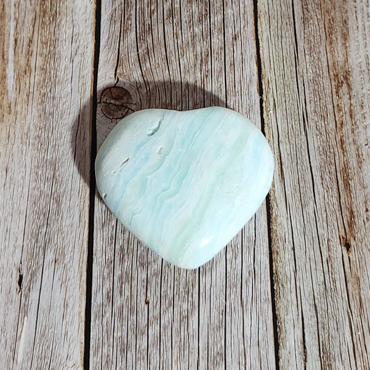 Light blue stone on a wooden surface