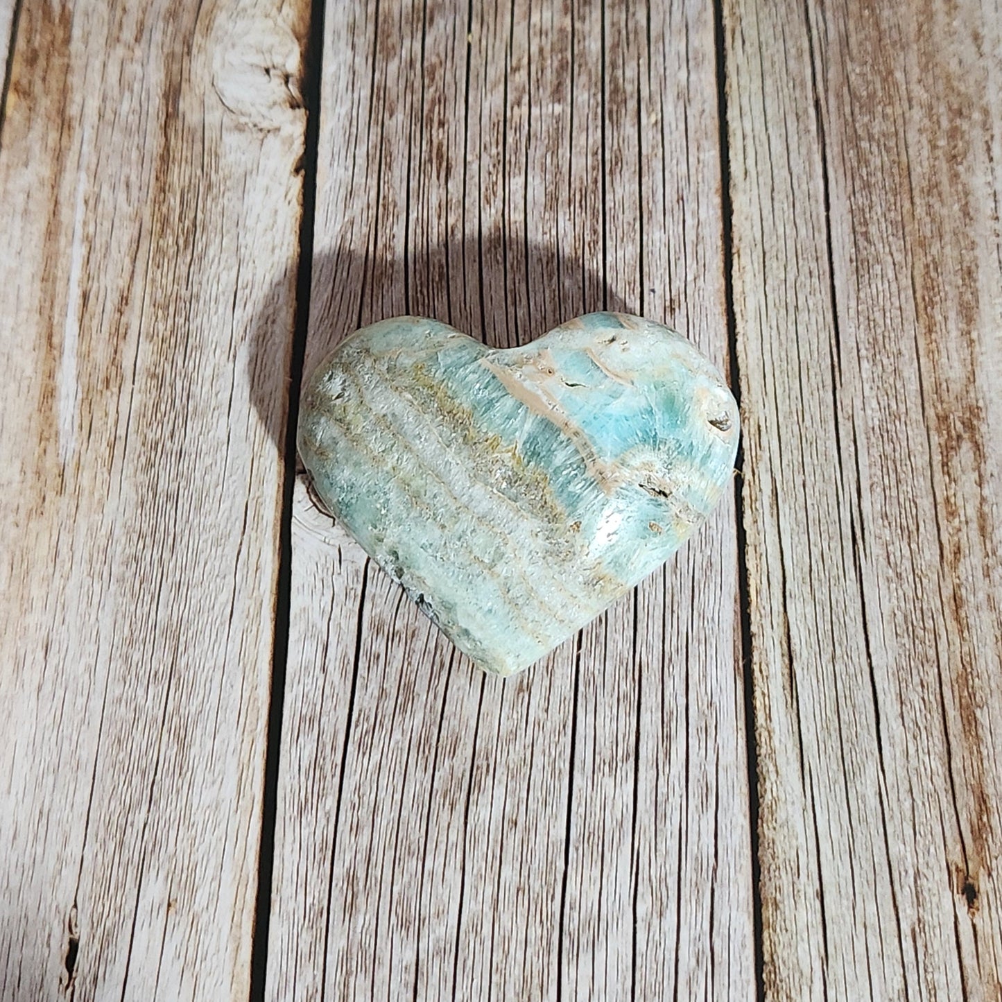Turquoise stone on a wooden surface
