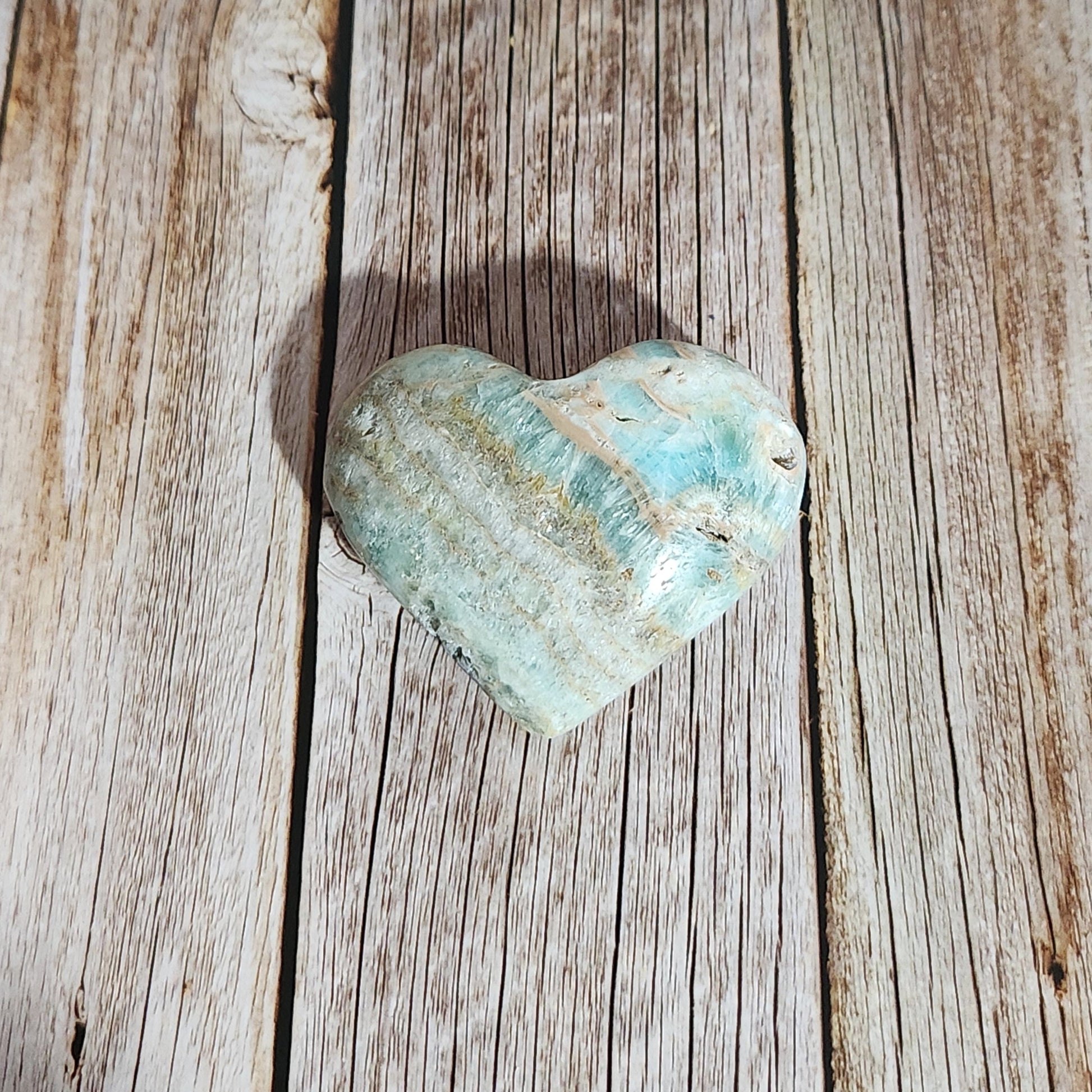 Turquoise stone on a wooden surface
