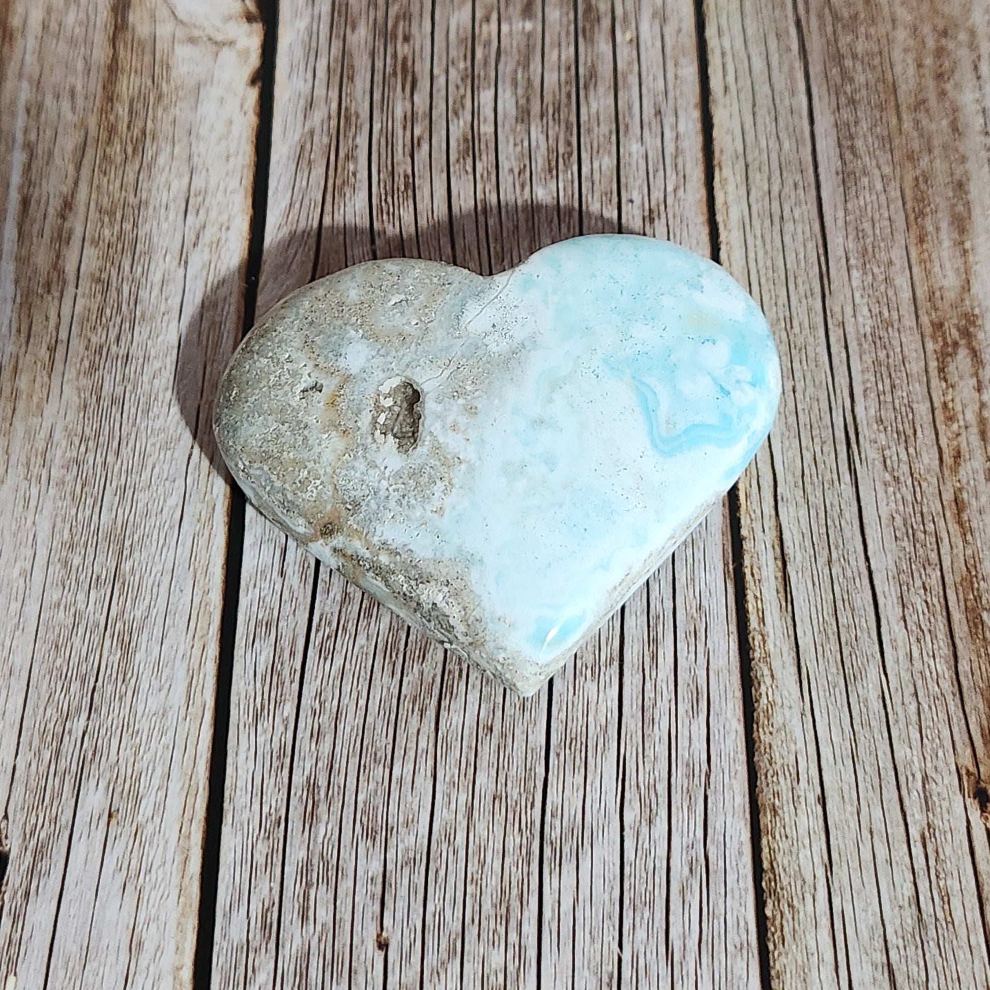 Turquoise stone on a wooden surface