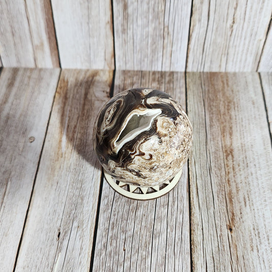 Decorative metal knocker on a wooden door