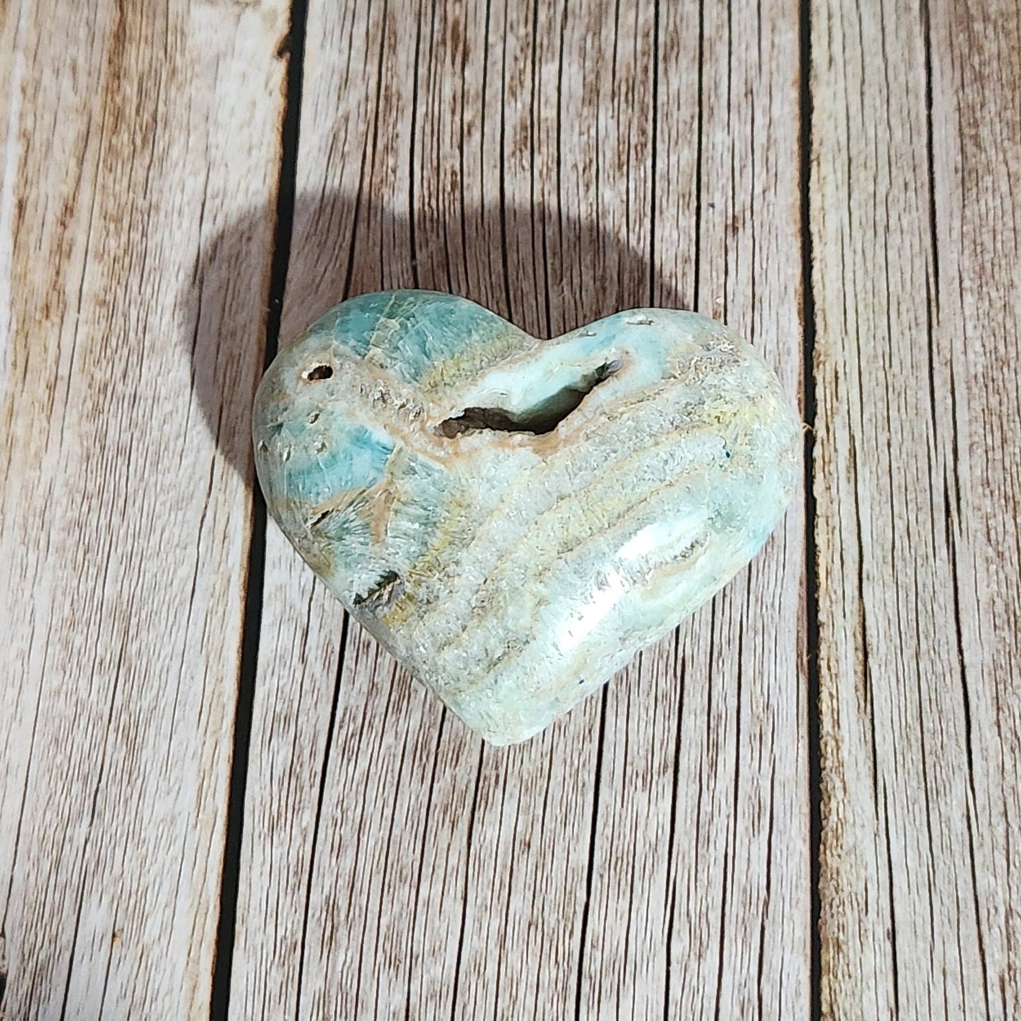 Turquoise stone on a wooden surface