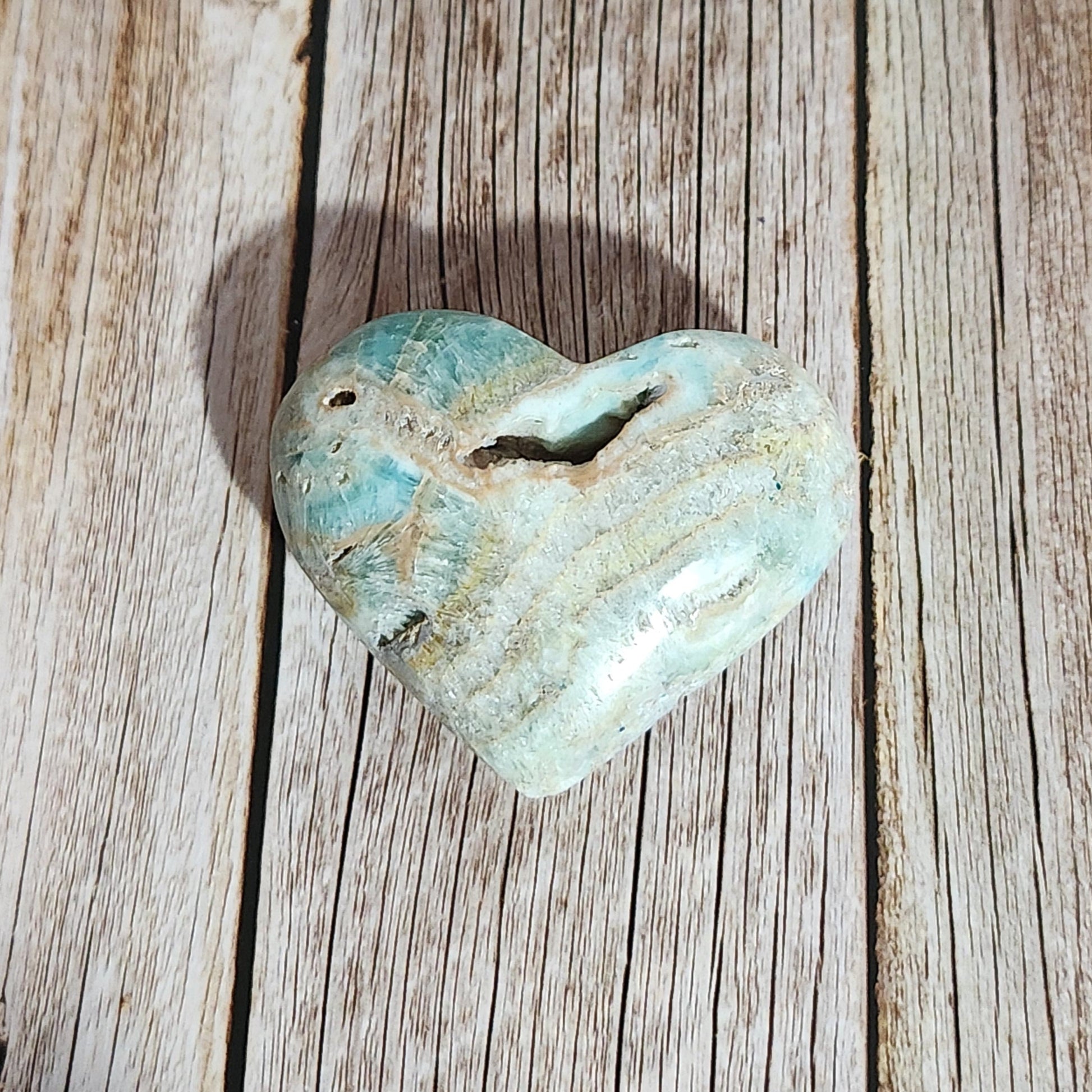 Turquoise stone on a wooden surface