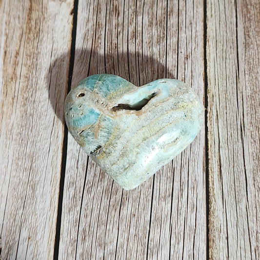 Turquoise stone on a wooden surface