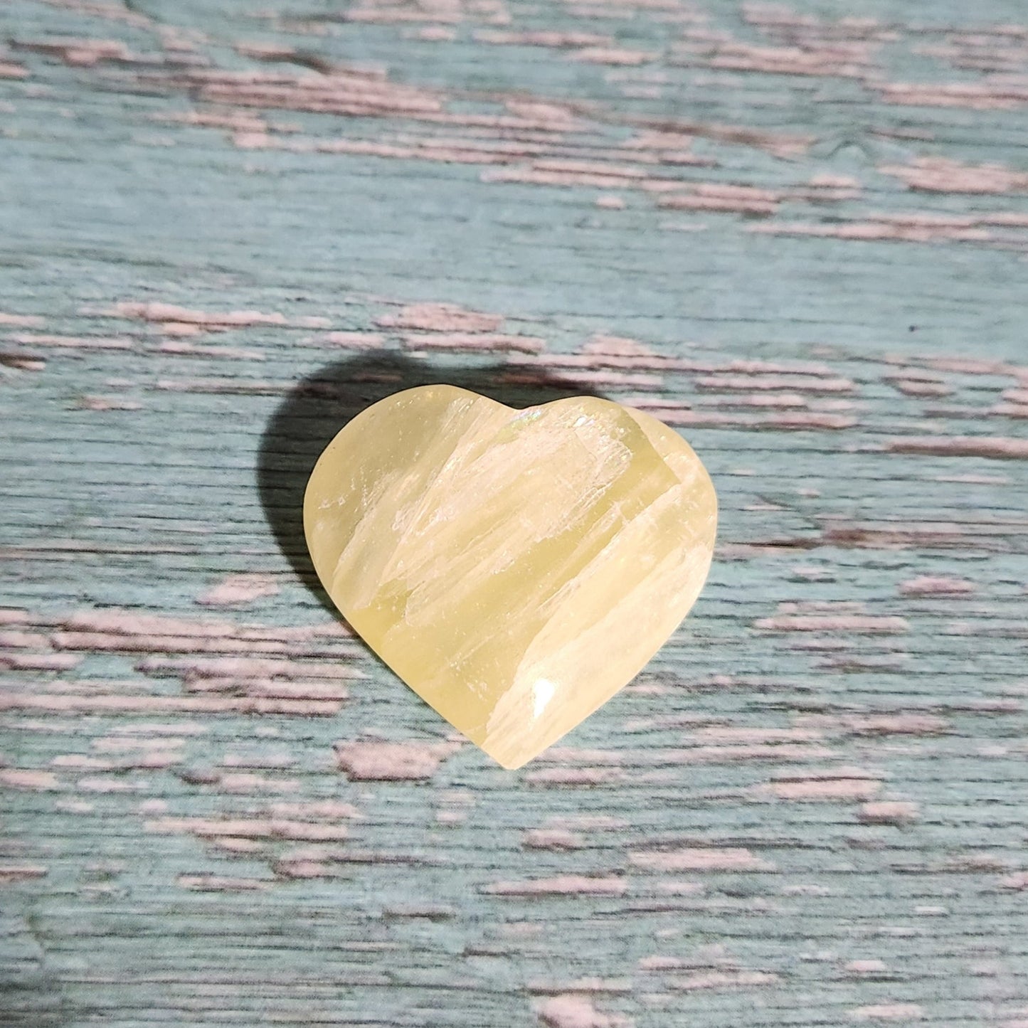 Yellow object on a textured blue surface