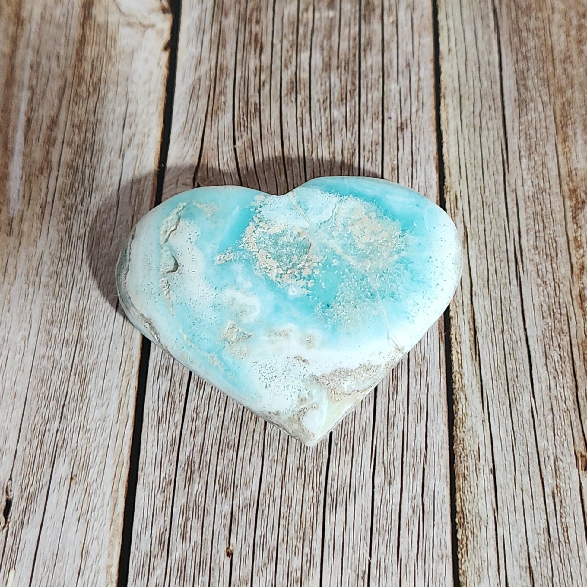 Turquoise stone on a wooden surface
