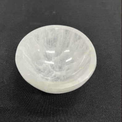 White stone bowl on a black background